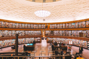 Stockholm, Sweden - July 2022. Public library with colorful books on shelfs at round building, Stadsbibliotek.