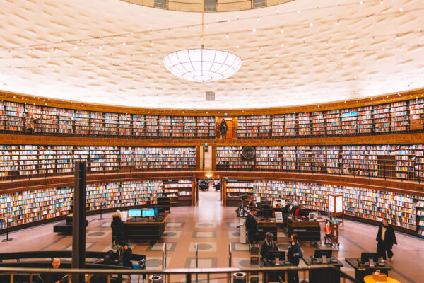 Stockholm, Sweden - July 2022. Public library with colorful books on shelfs at round building, Stadsbibliotek.