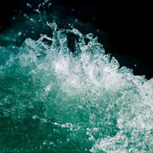 Splash of stormy water in the ocean on a black background