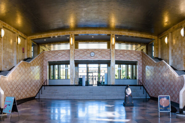 Frankfurt, Germany - Aug. 18, 2023: Lobby and double staircase of the IG Farben Building designed by Hans Poelzig in 1928, home to the Westend campus of the Goethe University Frankfurt since 2001.