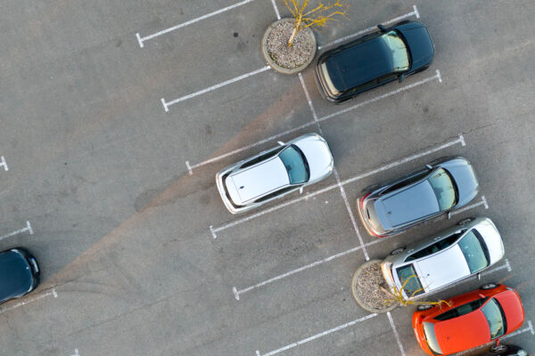 Aerial View of Sparse Parking Lot with Few Cars